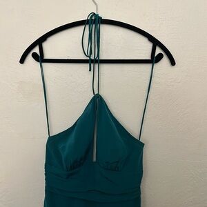 This is a Nicole Miller turquoise long maxi dress.